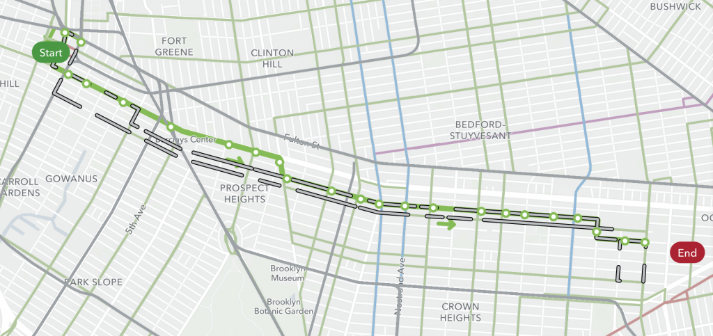 a screenshot of the proposed bus route from start to end. The current route is presented in gray and the new route is presented in green with white dots for stops. 